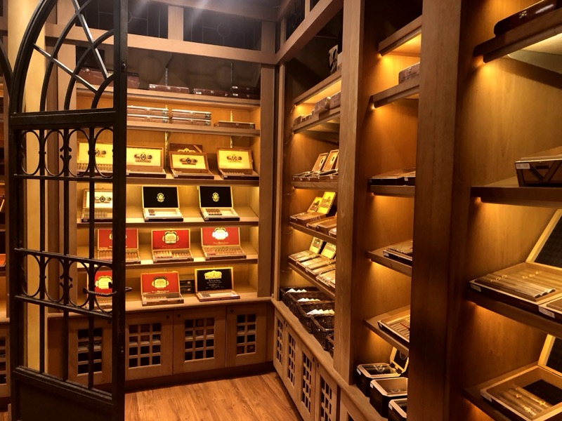 Inside the Casa Fuente walk-in humidor at the Forum Shops, October 2020 — wrought-iron gates and glowing shelves of Fuente cigars